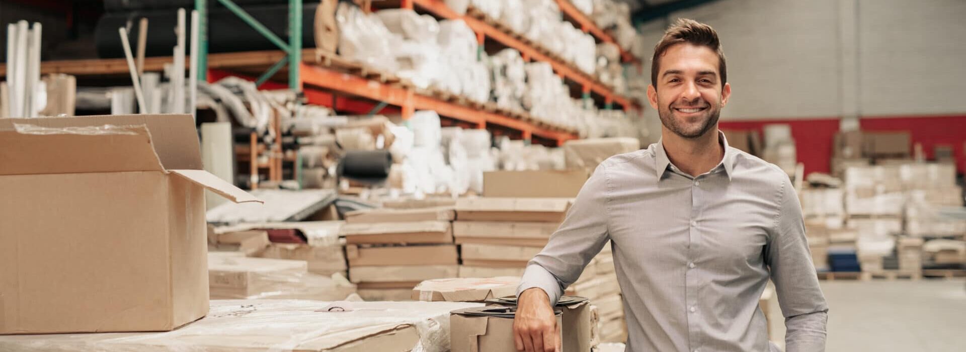 Young Businessman in Warehouse