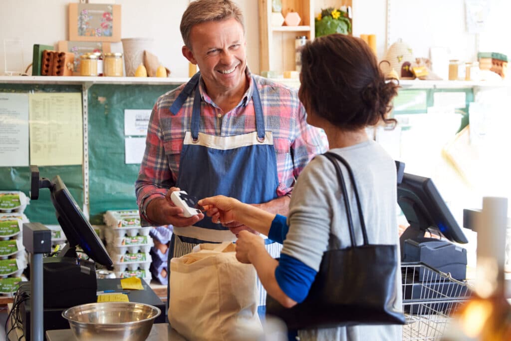 Customer at Checkout - Small Business Insurance